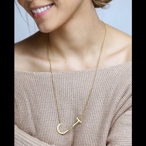 Sideways initial necklace for women.